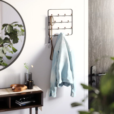 <p><strong>UMBRA Закачалки за стена или врата с 14 куки “ESTIQUE“<br /></strong><span><strong>• С 14 бр куки<br />• 2 бр куки за окачване на врата<br />• </strong></span><strong>Цвят:</strong><span> черен / орех</span><br /><span>• </span><strong>Размер:</strong><span> 36 x 11 x 60 см</span><br /><span>• </span><strong>Размер на опаковката:</strong><span> 38 х 6 х 38 см</span><br /><span>• </span><strong>Тегло:</strong><span> 0,78 кг</span><br /><span>• </span><strong>Материал:</strong><span> стомана</span><br /><strong>Производител: UMBRA / Канада</strong><br /><em><strong>DESIGN: EUGENIE DE LOYNES</strong></em></p><br />Марка: Umbra HK Limited <br />Модел: UMBRA 1004045-048<br />Доставка: 2-4 работни дни<br />Гаранция: 2 години