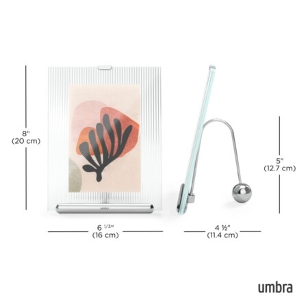 <p><strong>UMBRA Рамка за снимки “FLUTE“ - цвят хром - 10 x 15 см.</strong><br /><span><strong>• </strong></span><strong>Цвят:</strong><span> хром<br /><strong>• Свободно стояща<br />• За портретно или пейзажно изображение<br />• Изображението се поставя между две стъкла</strong></span><br /><strong>• Размер на рамката:</strong><span> 16 x 11,4 x 20 см</span><br /><strong>• Размер на снимката:</strong><span> 10 х 15 см.</span><br /><strong>• Тегло:</strong><span> 0,750 кг</span><br /><strong>• Материал:</strong><span> цинк, стъкло, стомана</span><br /><strong>Производител: UMBRA / Канада</strong><br /><em><strong>DESIGN: SUNG WOOK PARK</strong></em></p><br />Марка: Umbra HK Limited <br />Модел: UMBRA 1021416-158<br />Доставка: 2-4 работни дни<br />Гаранция: 2 години